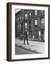 Children Watching a Policeman Walk His Beat in Front of Apartment Buildings-Ed Clark-Framed Photographic Print