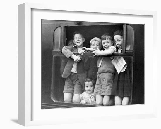 Children Waving While Being Evacuated-Associated Newspapers-Framed Photo