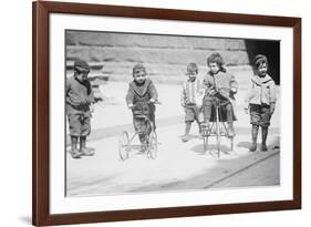 Children With Tricycles Playing In Manhattan Street-null-Framed Premium Giclee Print