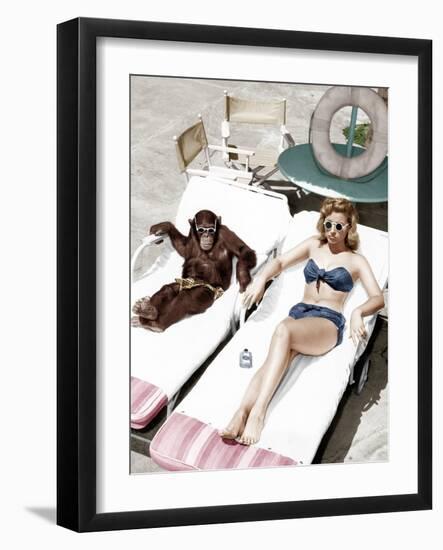 Chimpanzee and a Woman Sunbathing-null-Framed Photo