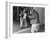 Chimpanzee in a Jacket and Trousers in Front of a Mirror-null-Framed Photo