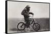 Chimpanzee Titine Riding a Bicycle at the Zoo in Berlin-null-Framed Stretched Canvas