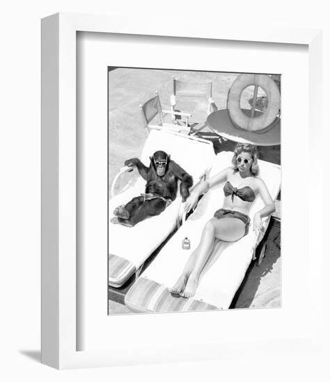 Chimpanzee & Woman Sunbathing-null-Framed Art Print