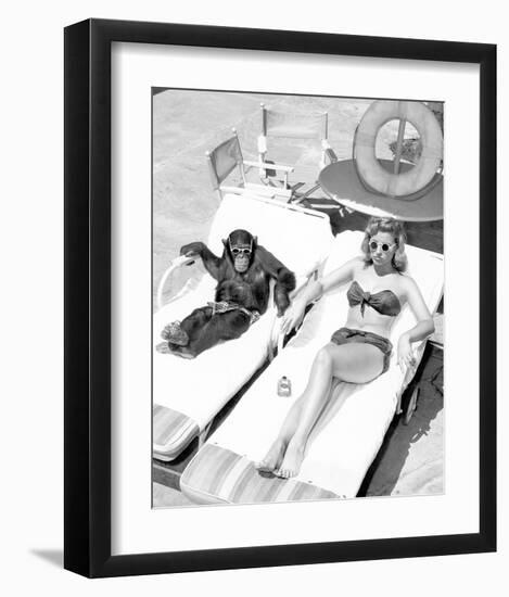 Chimpanzee & Woman Sunbathing-null-Framed Art Print