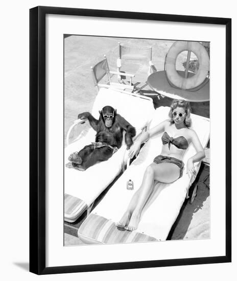 Chimpanzee & Woman Sunbathing-null-Framed Art Print