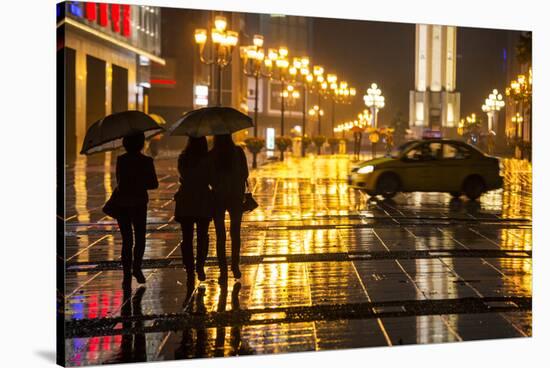 China, Chongqing, Pedestrians Walking with Umbrellas Along the Street-Paul Souders-Stretched Canvas