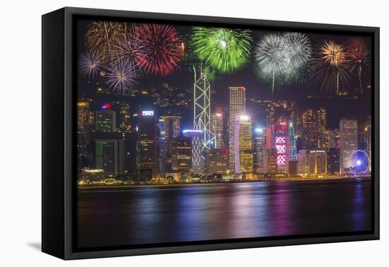 China, Hong Kong. Fireworks over city at night.-Jaynes Gallery-Framed Stretched Canvas