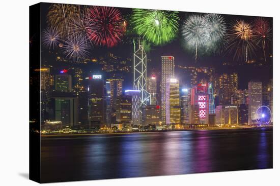 China, Hong Kong. Fireworks over city at night.-Jaynes Gallery-Stretched Canvas