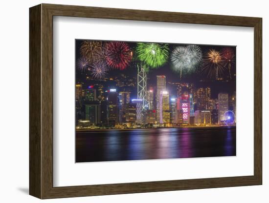 China, Hong Kong. Fireworks over city at night.-Jaynes Gallery-Framed Photographic Print