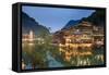 China, Hunan province, Fenghuang, riverside houses by night reflecting in the river-Maurizio Rellini-Framed Stretched Canvas