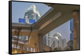 China, Jiangsu, Nanjing. Expressway and modern buildings near Nanjing South Station.-Rob Tilley-Framed Stretched Canvas