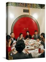 Chinese Family During Dinner at a Traditonally Decorated Restaurant-null-Stretched Canvas