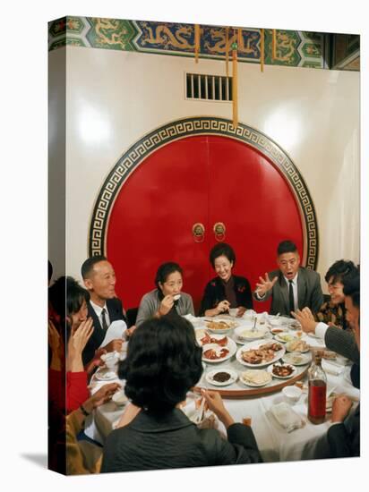 Chinese Family During Dinner at a Traditonally Decorated Restaurant-null-Stretched Canvas