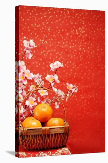 Chinese New Year Decoration--A Basket of Oranges with Plum Flower on a Festive Background.-Liang Zhang-Stretched Canvas