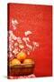 Chinese New Year Decoration--A Basket of Oranges with Plum Flower on a Festive Background.-Liang Zhang-Stretched Canvas