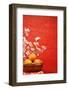 Chinese New Year Decoration--A Basket of Oranges with Plum Flower on a Festive Background.-Liang Zhang-Framed Photographic Print