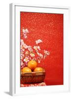 Chinese New Year Decoration--A Basket of Oranges with Plum Flower on a Festive Background.-Liang Zhang-Framed Photographic Print