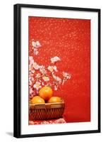 Chinese New Year Decoration--A Basket of Oranges with Plum Flower on a Festive Background.-Liang Zhang-Framed Photographic Print