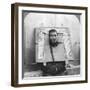 Chinese Prisoner in the Cangue Placarded with the Record of His Crime, China, 1902-CH Graves-Framed Photographic Print