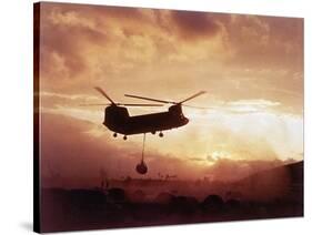 Chinook Helicopter Lifts Ammunition-null-Stretched Canvas