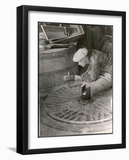 Chipping out the Cutting Edges (Dressing) a Millstone at the Old Flour Mill at Ewell Surrey-null-Framed Art Print