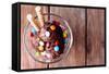 Chocolate Ice Cream with Multicolor Candies and Wafer Rolls in Glass Bowl, on Wooden Background-Yastremska-Framed Stretched Canvas