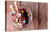 Chocolate Ice Cream with Multicolor Candies and Wafer Rolls in Glass Bowl, on Wooden Background-Yastremska-Stretched Canvas