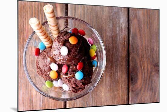 Chocolate Ice Cream with Multicolor Candies and Wafer Rolls in Glass Bowl, on Wooden Background-Yastremska-Mounted Photographic Print