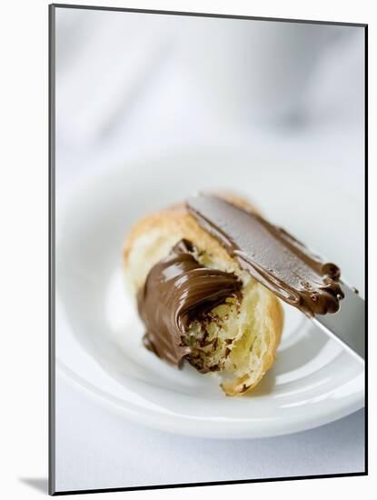 Chocolate Spread on a Croissant with a Knife-Ira Leoni-Mounted Photographic Print