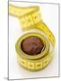 Chocolate Truffle Lying in Rolled-Up Tape Measure-Elisabeth Cölfen-Mounted Photographic Print