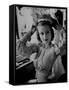 Chorus Girl Hope Chandler Securing Her Feathered Headdress as She Sits at Makeup Table-Peter Stackpole-Framed Stretched Canvas