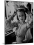 Chorus Girl Hope Chandler Securing Her Feathered Headdress as She Sits at Makeup Table-Peter Stackpole-Mounted Photographic Print