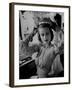 Chorus Girl Hope Chandler Securing Her Feathered Headdress as She Sits at Makeup Table-Peter Stackpole-Framed Photographic Print