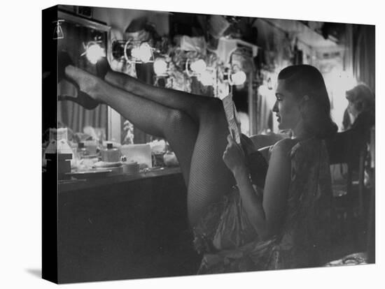 Chorus Girl-Singer Linda Lombard, Resting Her Legs after a Tough Night on Stage-George Silk-Stretched Canvas