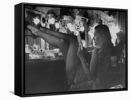 Chorus Girl-Singer Linda Lombard, Resting Her Legs after a Tough Night on Stage-George Silk-Framed Stretched Canvas