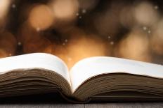 Open Book on Wooden Table with Bokeh Effect in the Background-Chris_Elwell-Stretched Canvas