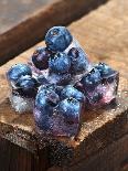 Ice Cubes with Blueberries on a Wooden Table-Chris Schäfer-Photographic Print