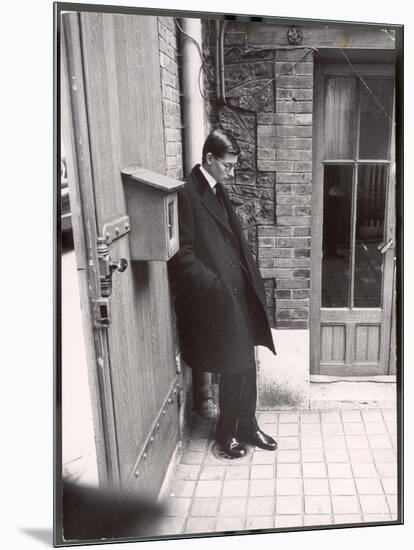 Christian Dior's Successor Yves Saint Laurent Standing Alone After Attending Dior's Funeral-Loomis Dean-Mounted Photographic Print