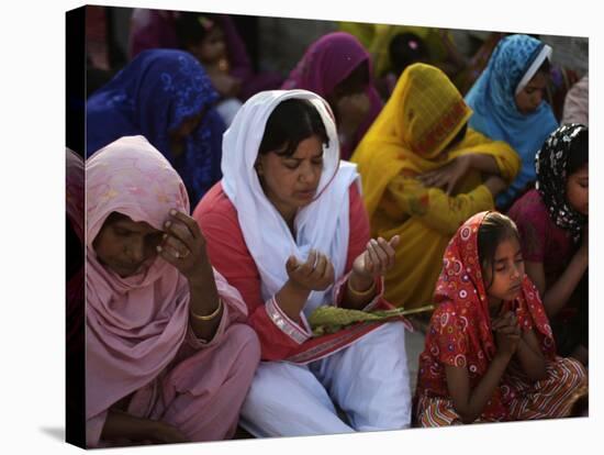 Christians Pray During a Ceremony to Celebrate Orthodox Palm Sunday, Outside a Church in Pakistan-null-Stretched Canvas