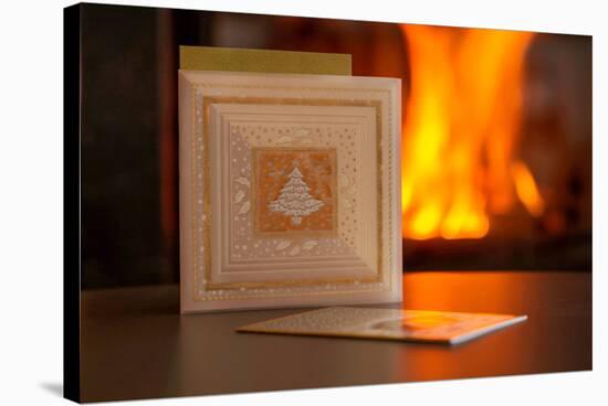 Christmas cards, fireplace with fire on background-Paivi Vikstrom-Stretched Canvas