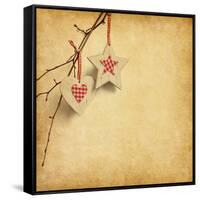 Christmas Decoration Hanging over Old Paper Background-A_nella-Framed Stretched Canvas