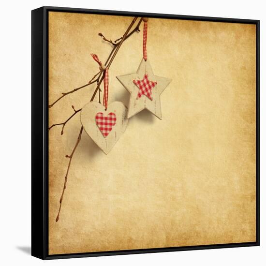 Christmas Decoration Hanging over Old Paper Background-A_nella-Framed Stretched Canvas