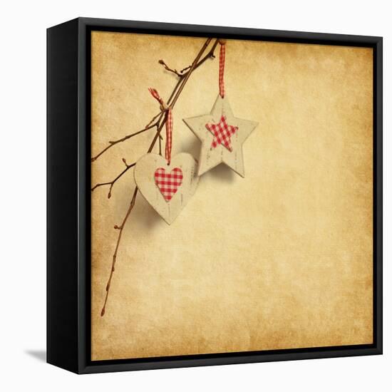 Christmas Decoration Hanging over Old Paper Background-A_nella-Framed Stretched Canvas