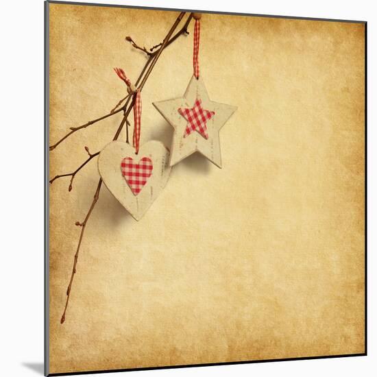 Christmas Decoration Hanging over Old Paper Background-A_nella-Mounted Art Print
