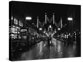 Christmas Lights and Decorations in Regent Street, London 1966-null-Stretched Canvas