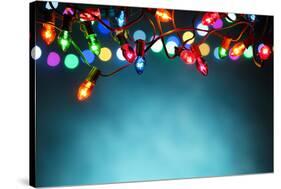 Christmas Lights over Dark Blue Background-Sofiaworld-Stretched Canvas