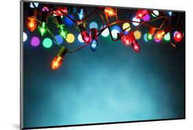 Christmas Lights over Dark Blue Background-Sofiaworld-Mounted Photographic Print