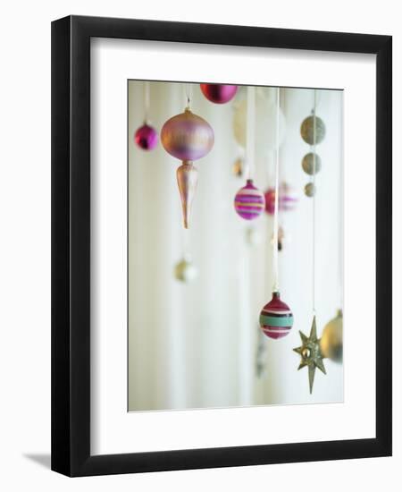 Christmas Ornaments Hanging from Strings-Ryan Mcvay-Framed Photographic Print