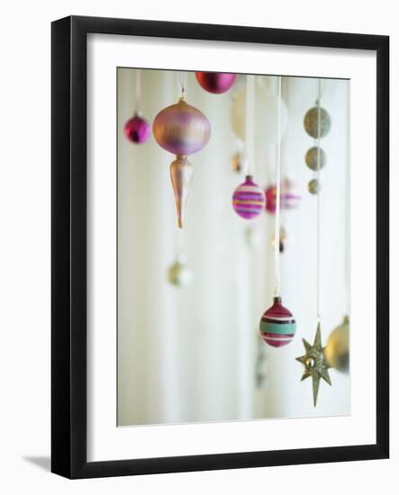 Christmas Ornaments Hanging from Strings-Ryan Mcvay-Framed Photographic Print