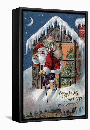 Chrsitmas Greetings from Colorado - Santa Climbing Out Window-Lantern Press-Framed Stretched Canvas